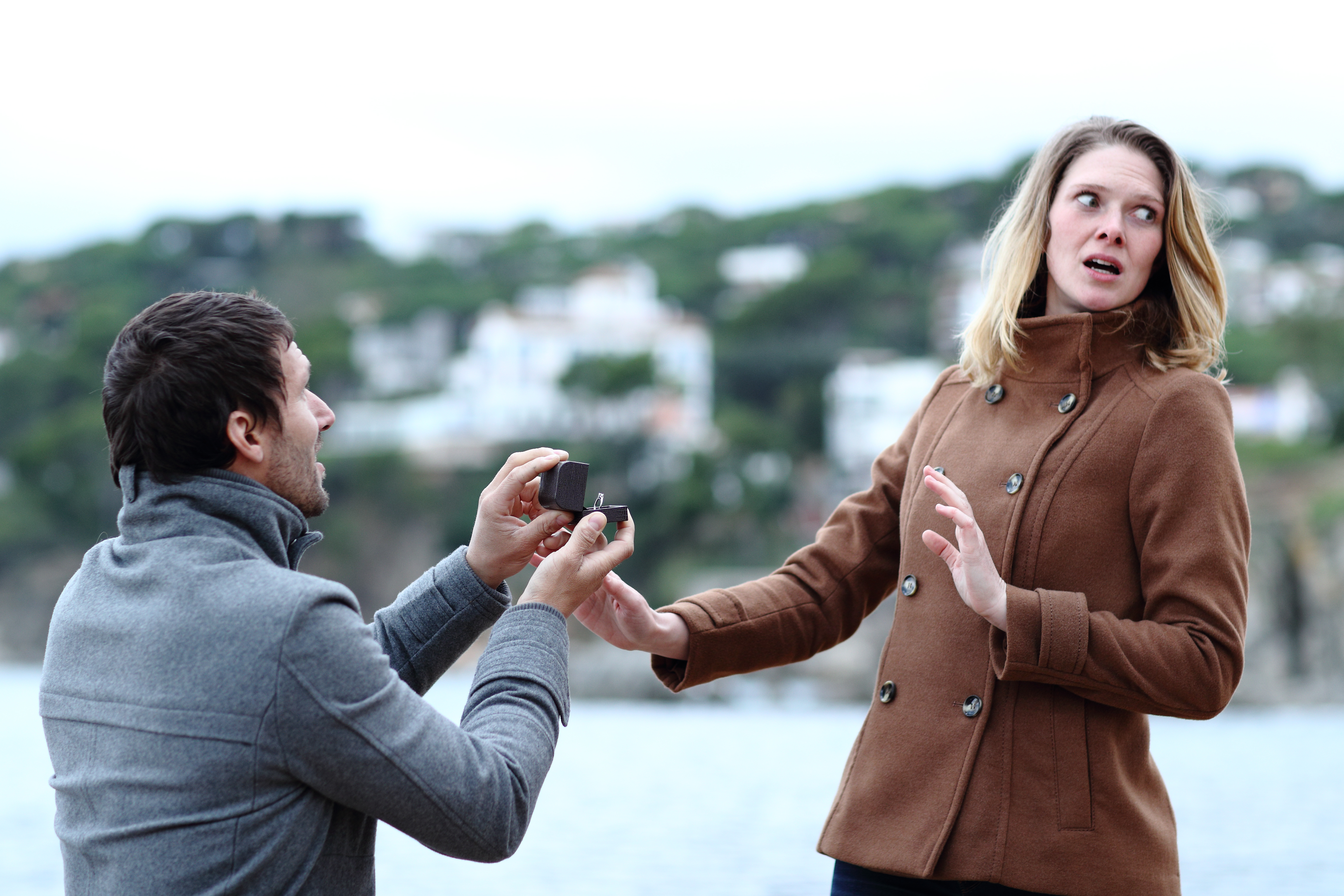 Shocked woman rejecting a man's proposal | Source: Shutterstock