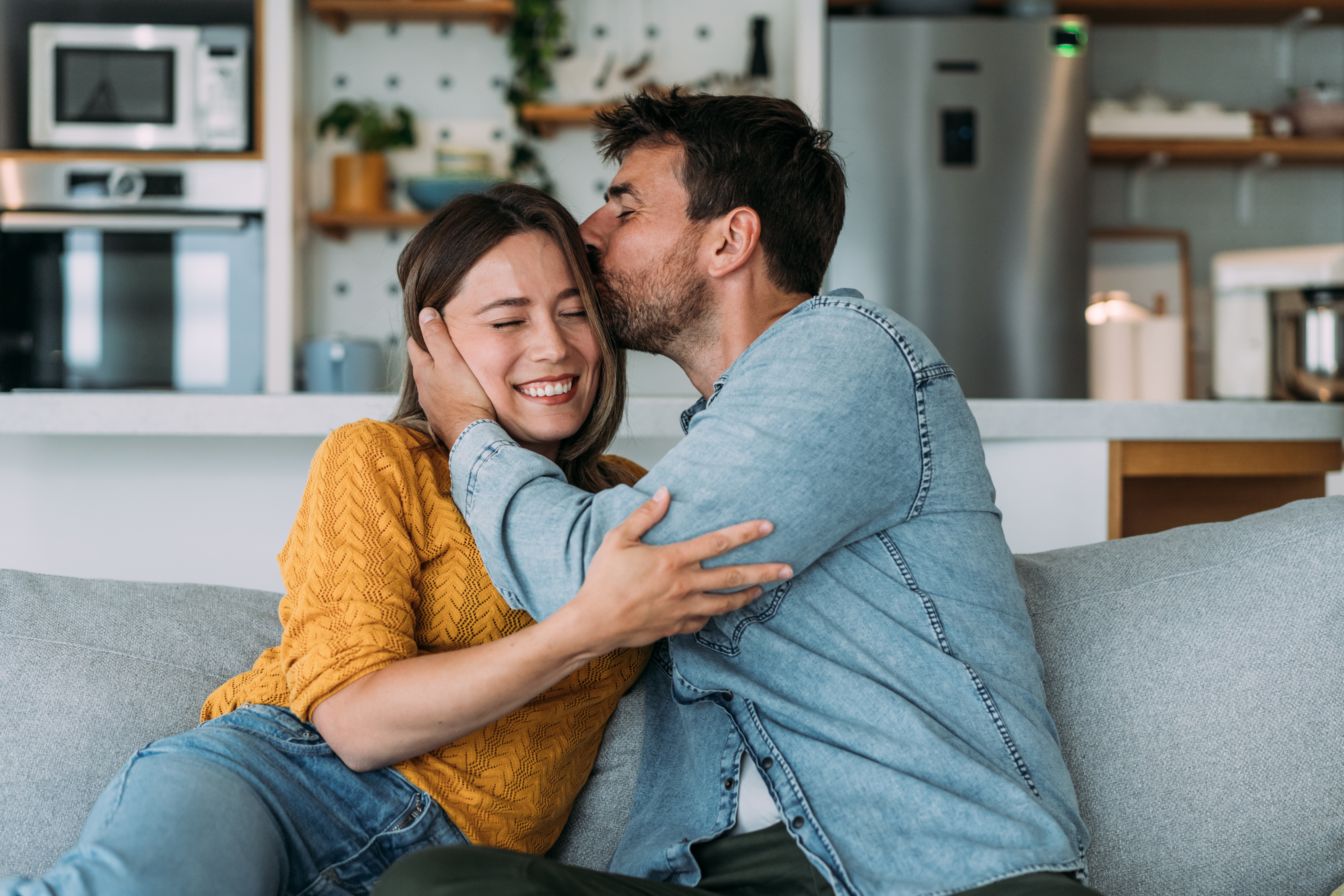 Happy couple at home | Source: Getty Images