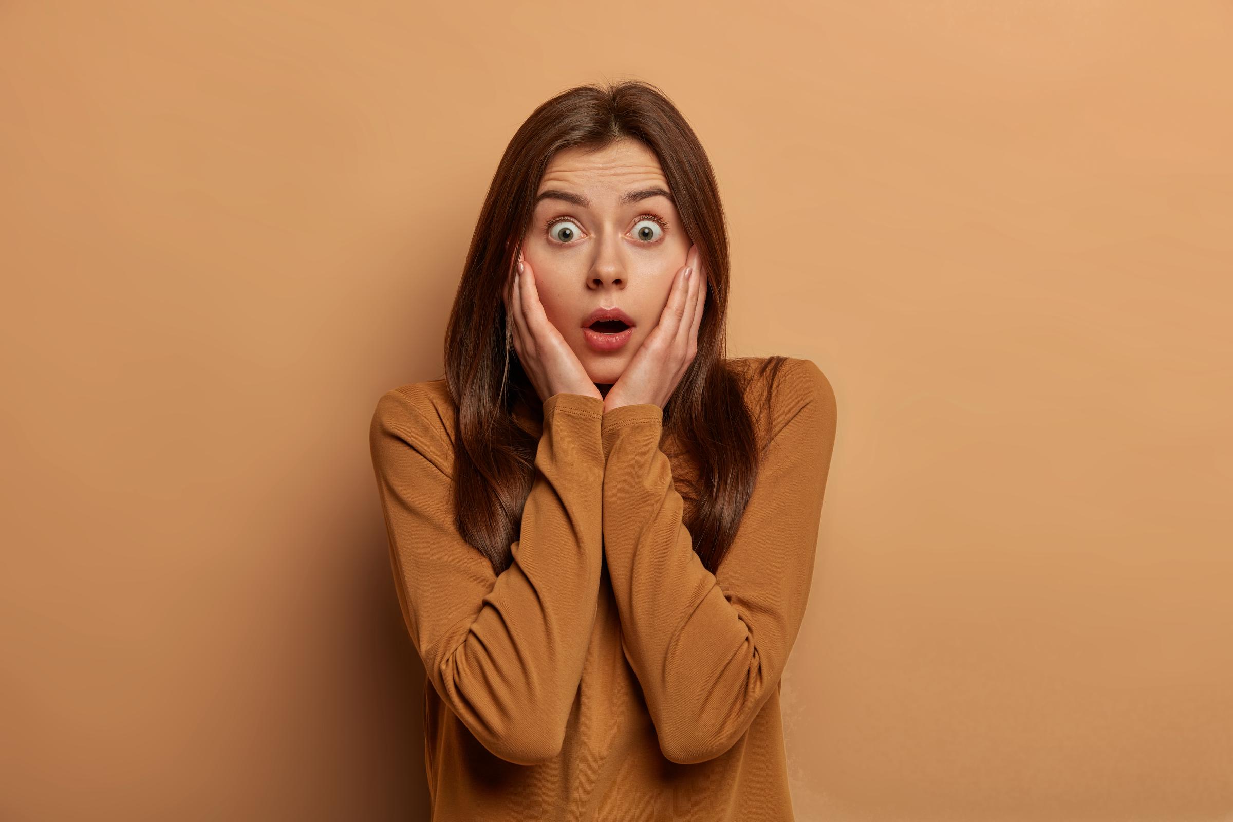 A shocked woman | Source: Freepik