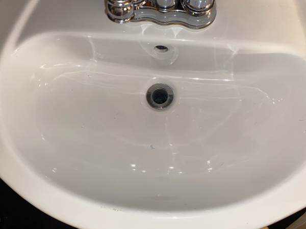 The Small Hole in Your Sink: Its Purpose and How It Keeps Your Bathroom Dry