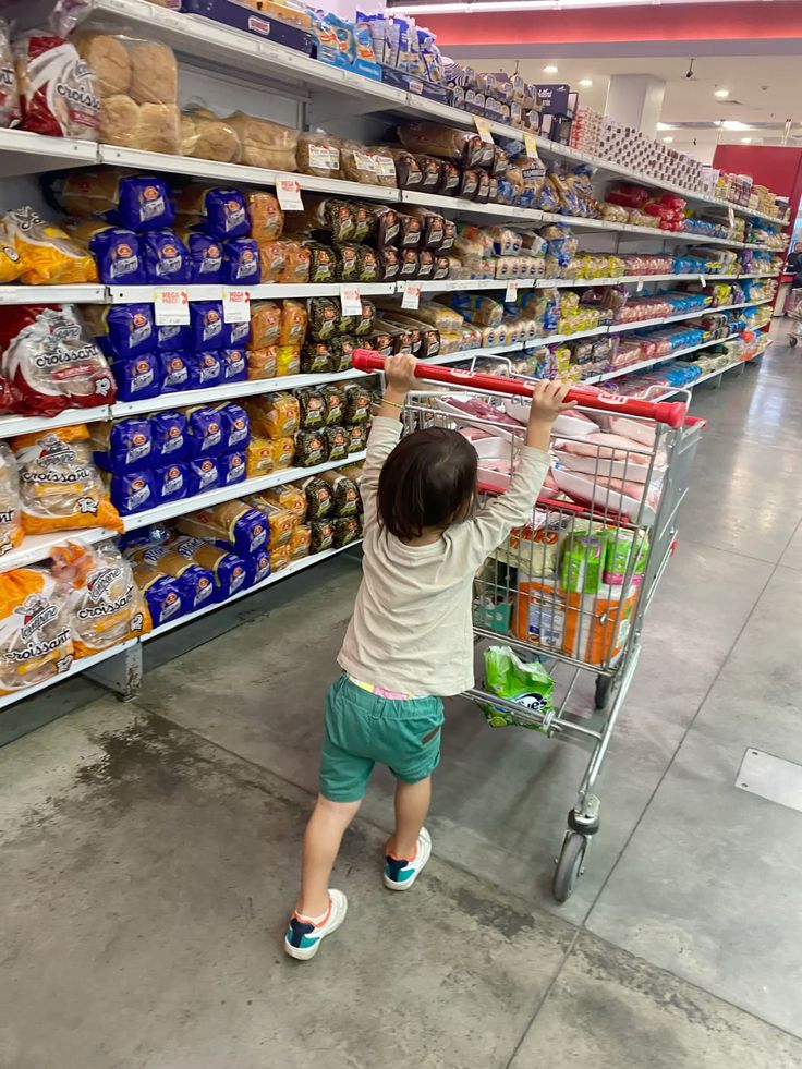 THE LITTLE BOY WITH THE HUGE SHOPPING CART WOULDN’T STOP