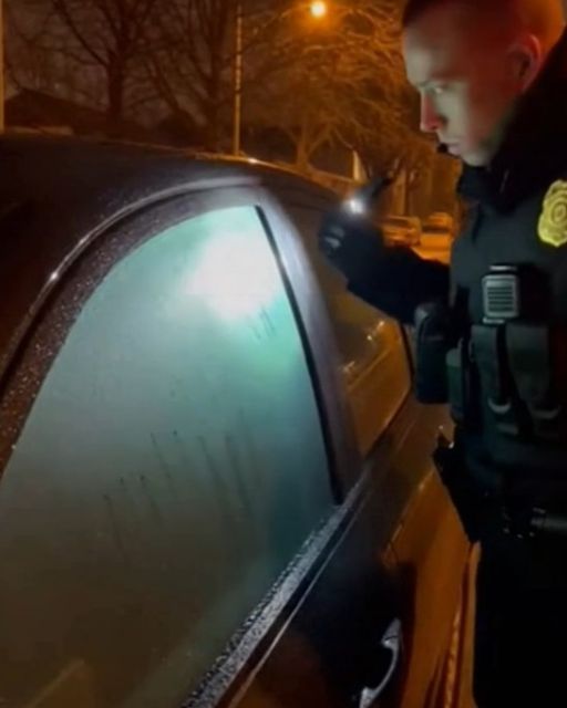 Police Officer Checks A Car With Fogged Windowsโthe Engine Is Off
